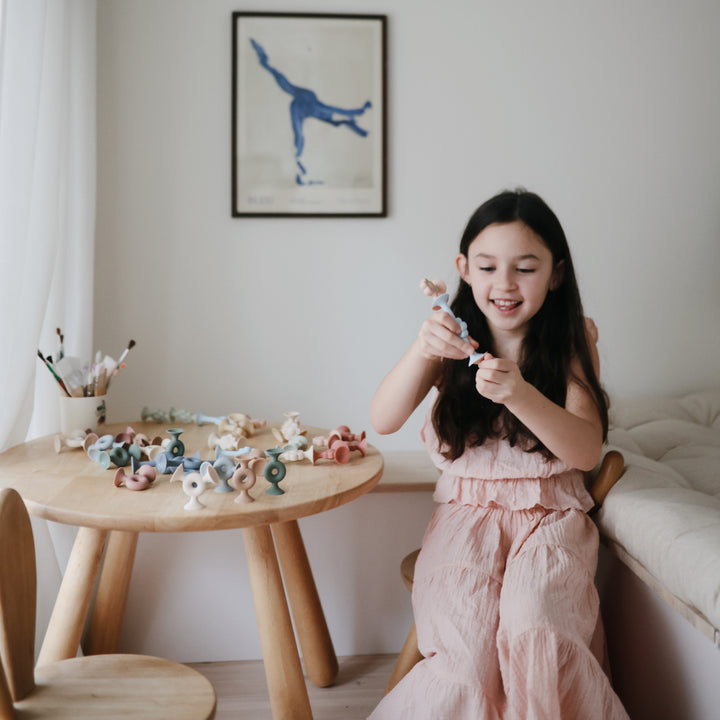 Set of colorful silicone shapes with suction cup ends.