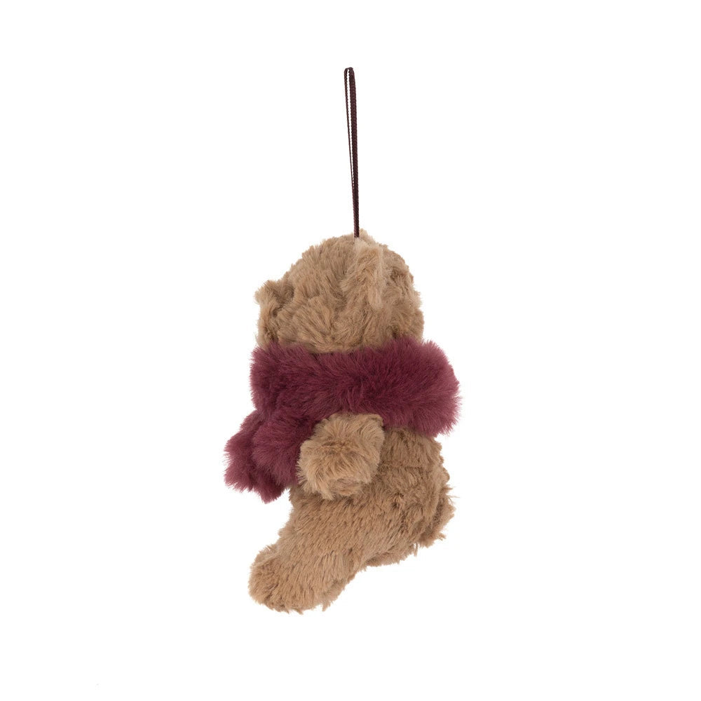 A small plush teddy bear ornament or hanging decoration in light brown with a fuzzy burgundy scarf and a matching hanging loop at the top, shown on a plain white background.