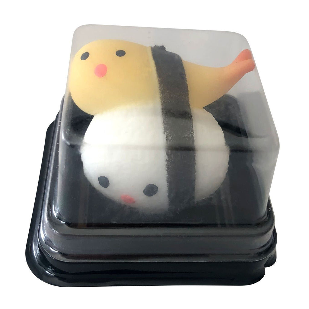 Two packaged and two unpackaged squishy sushi toys on a plain white background. The set includes a yellow and white sushi piece with a black band, a white and orange striped sushi piece, and their clear plastic boxes with printed labels reading 'Super Squishy Squishy Sushi'.