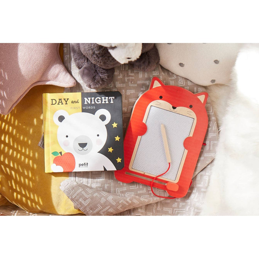Red fox-shaped drawing board with a string on a white background