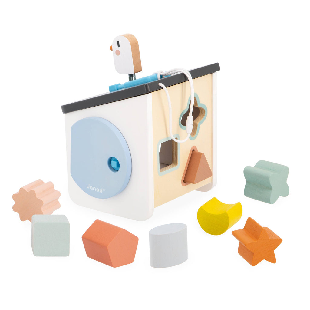 Wooden shape sorting cube toy with various geometric shapes on a white background