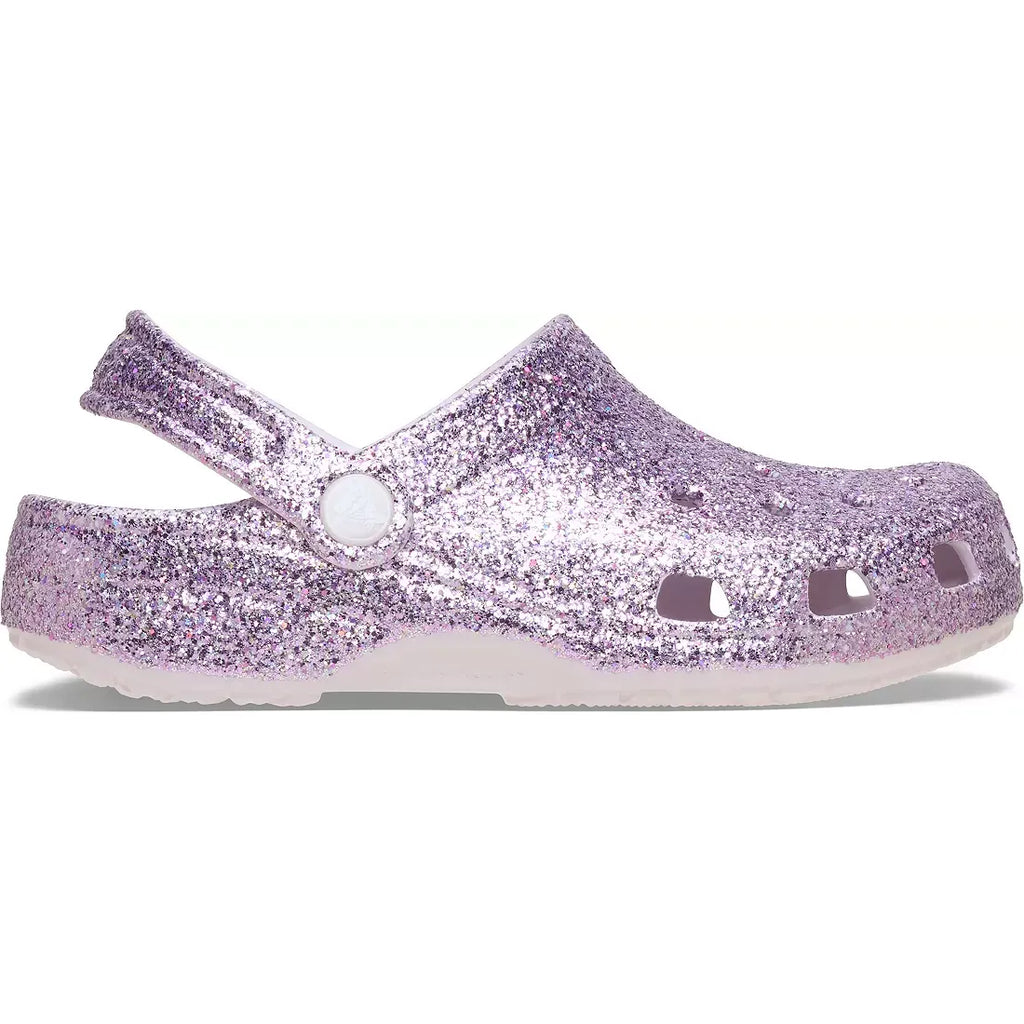 Pair of glittery purple clogs on a white background