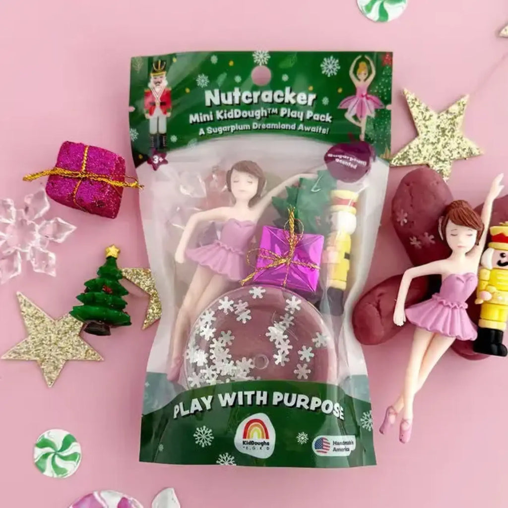 Build a festive scene for your Nutcracker and bring a classic winter tale to life. Includes: 2oz Purple KidDough with snowflake glitter, ballerina, nutcracker, present, christmas tree, snowflake