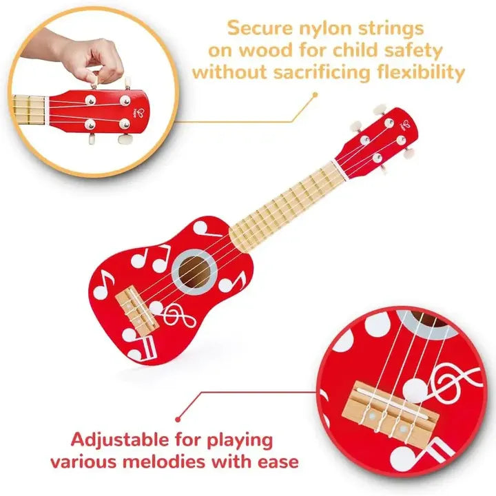 A red wooden ukulele with white musical notes and symbols, including a tuning key.