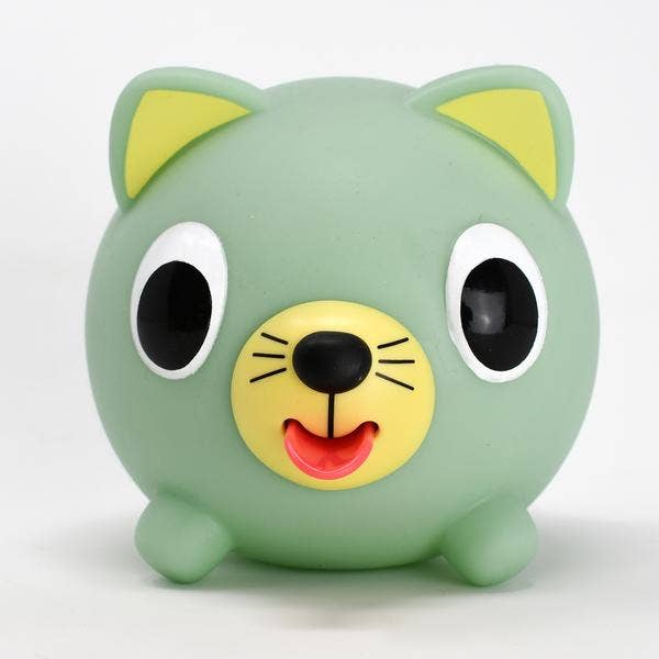 Green cat-shaped toy with a hand interacting with it on a white background