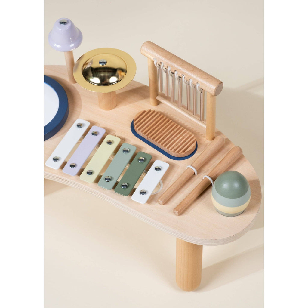 Set of wooden musical instruments on a beige background