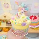 Toy set in a decorative container with a pink bow on a white background