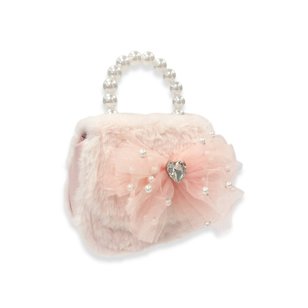 Pink handbag with tulle and pearl details on a white background