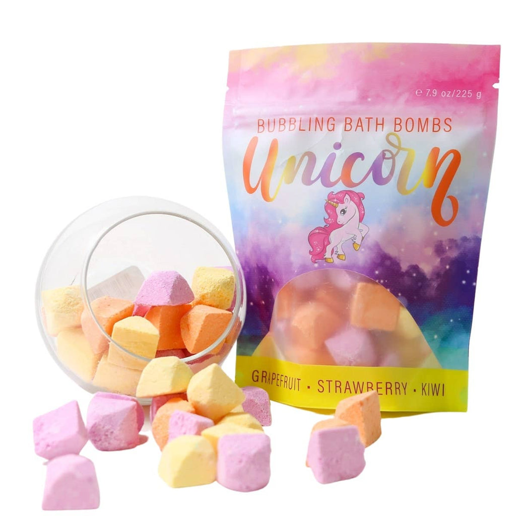Pack of unicorn-themed bubbling bath bombs with fruits and marshmallows on a light background