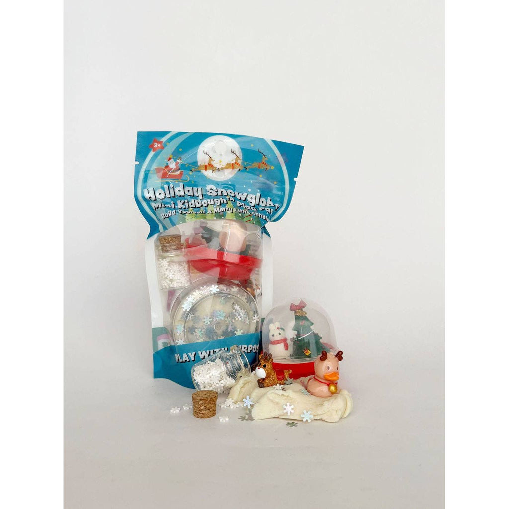 Includes: 2oz White Dough with snowflake glitter, snowglobe dome, Christmas tree figure, micro snowman, micro reindeer, micro stocking, jar of snowflakes