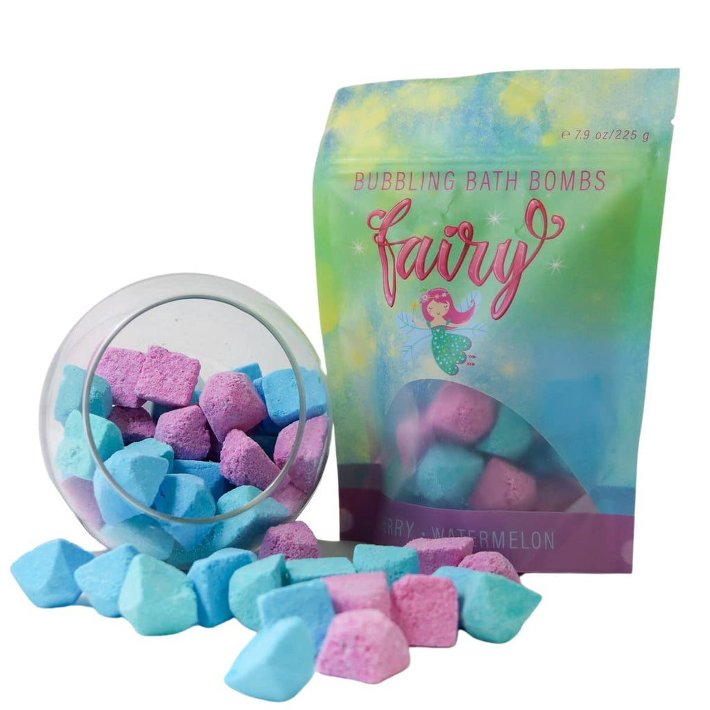 Pack of fairy-themed bath bombs with colorful packaging on a soapy background