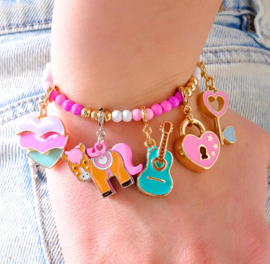 Horse-shaped charm with pink mane on a white background