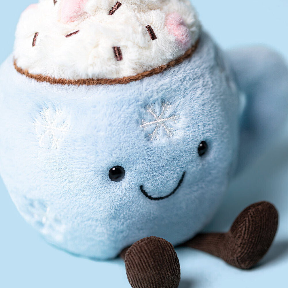 Jellycat Amuseables Hot Chocolate with Marshmallows in a blue cup with snowflake decorations