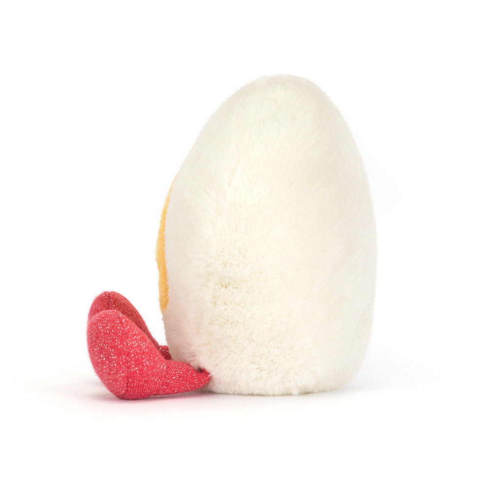 Heart-shaped hard boiled egg plush with red sparkly legs.