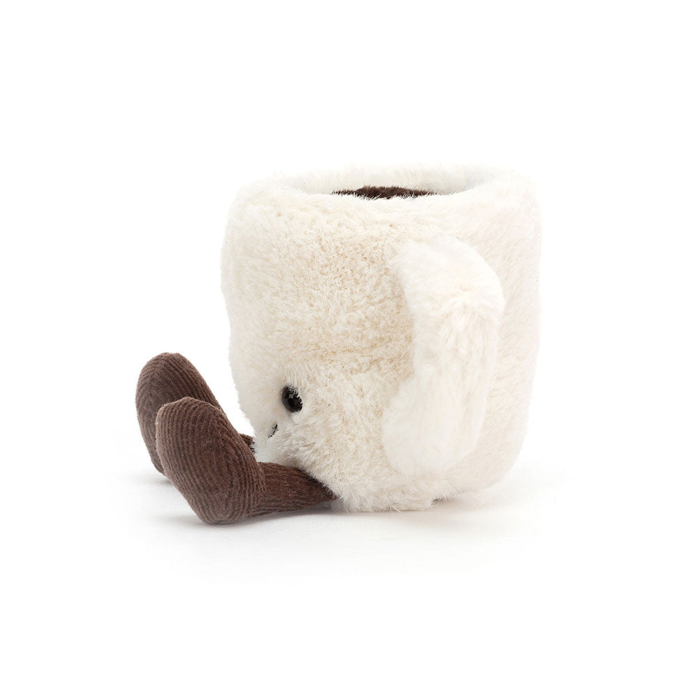 Knitted mug-shaped plush toy with a smiling face on a white background