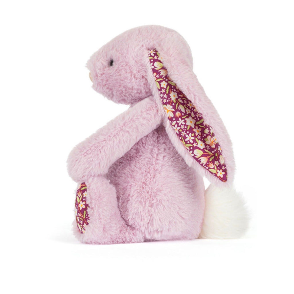 Floral-patterned plush bunny toy on a white background
