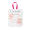 Packaged hair accessories with pink and gold design on a white background, featuring the brand 'Rockahula'.