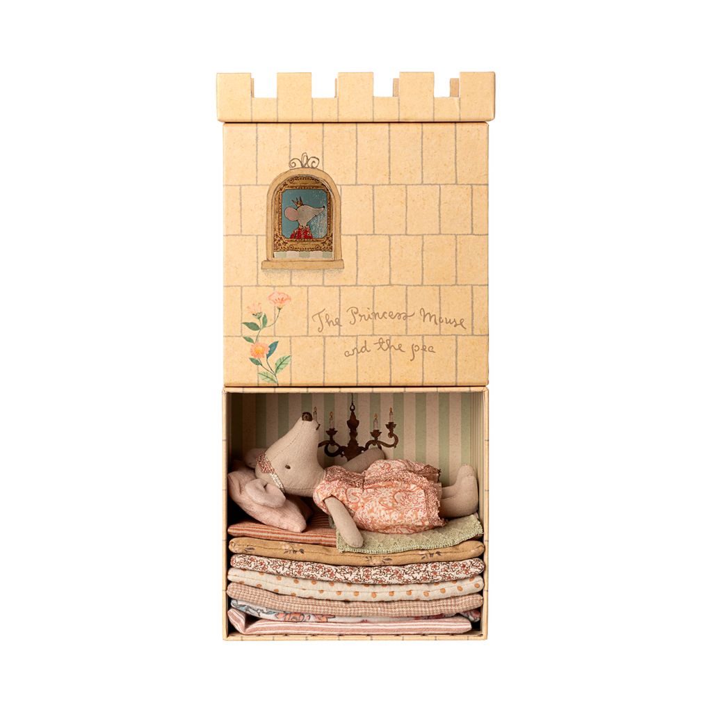 Wooden castle toy with a mouse doll in a dress on a white background