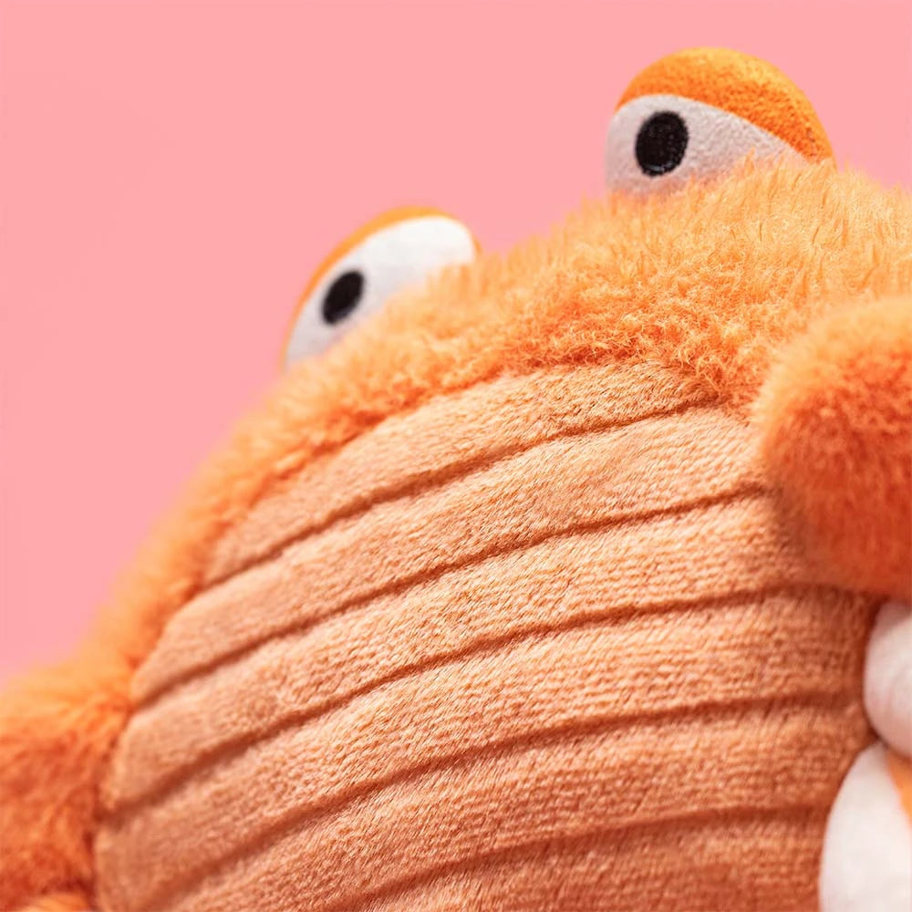 Plush crab toy on a white background
