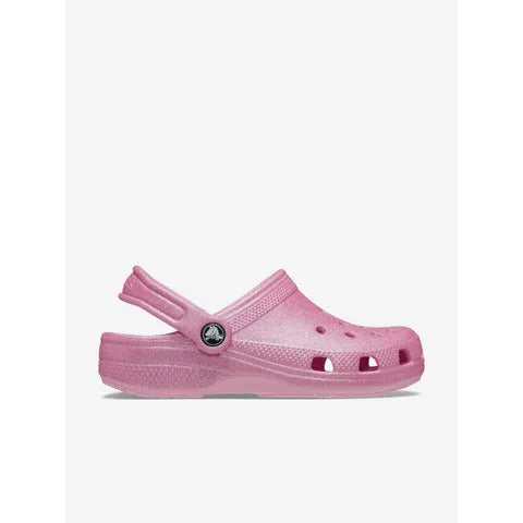Pair of pink clogs on a white background