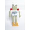 Crocheted frog toy wearing a striped shirt and yellow boots on a white background