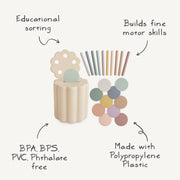 Set of pastel-colored paint sticks with a container and color swatches on a white background