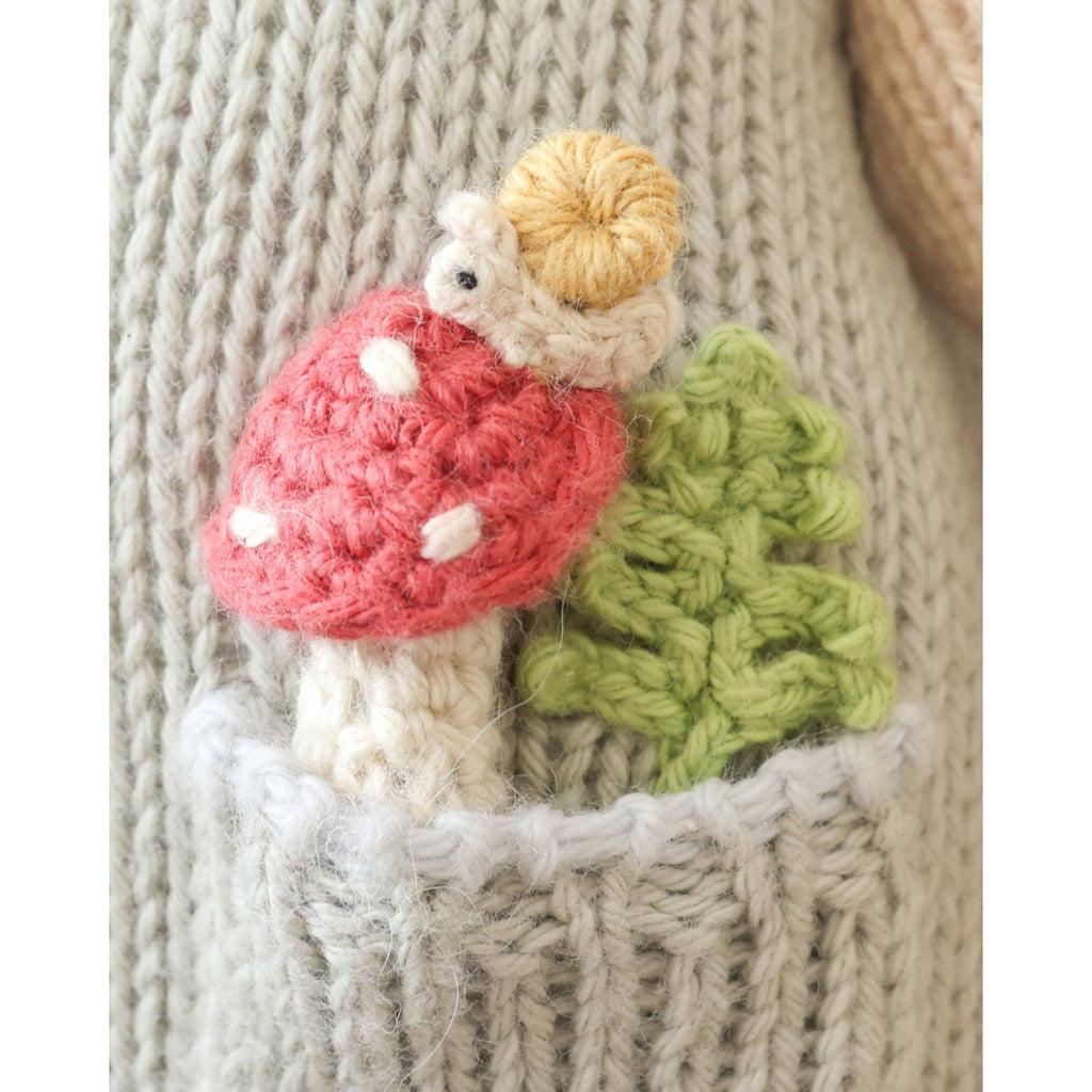 Knitted teddy bear toy with overalls
