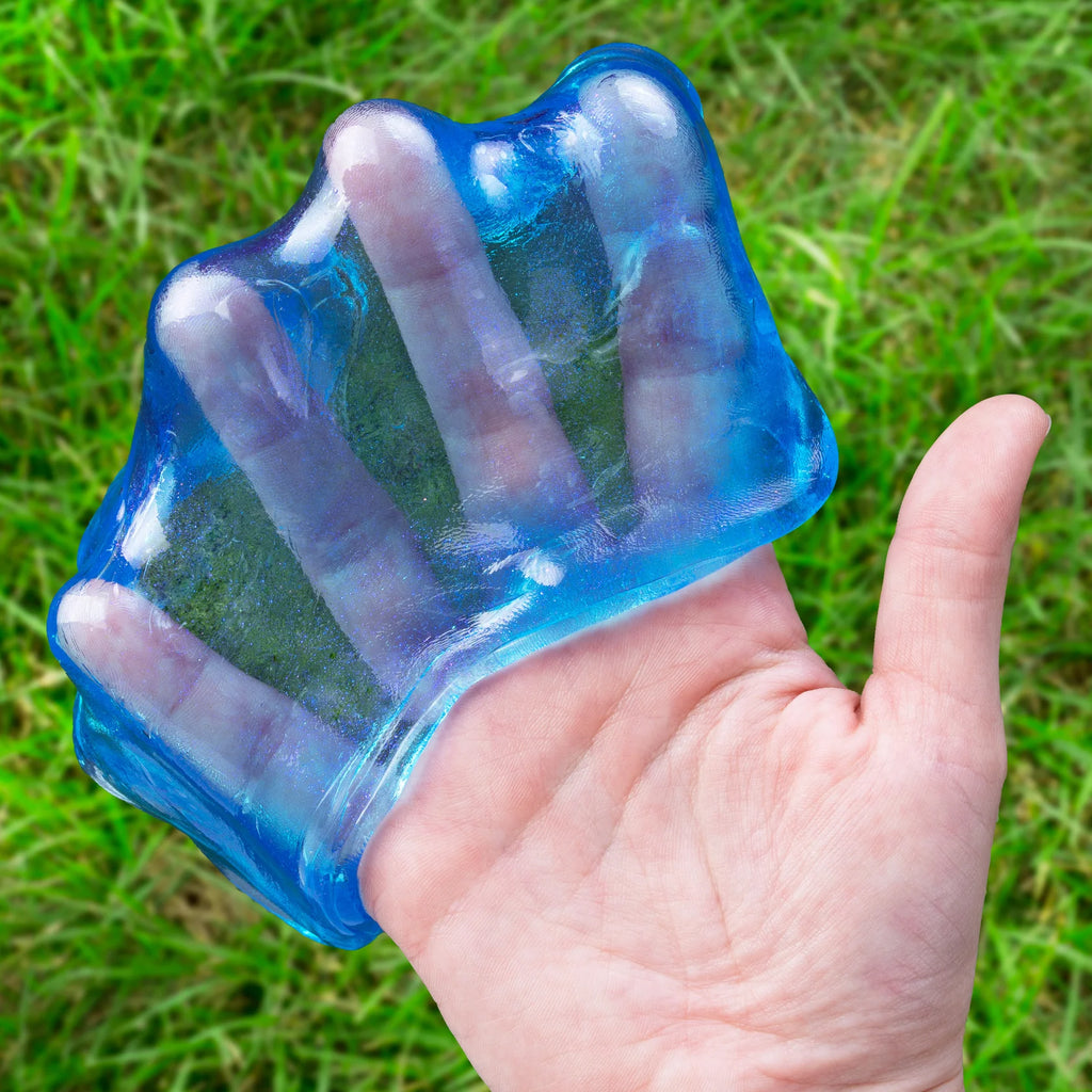 Open round metal tin of Crazy Aaron's Thinking Putty in the color 'Falling Water', showing bright blue translucent slime inside with the product label visible on the lid.