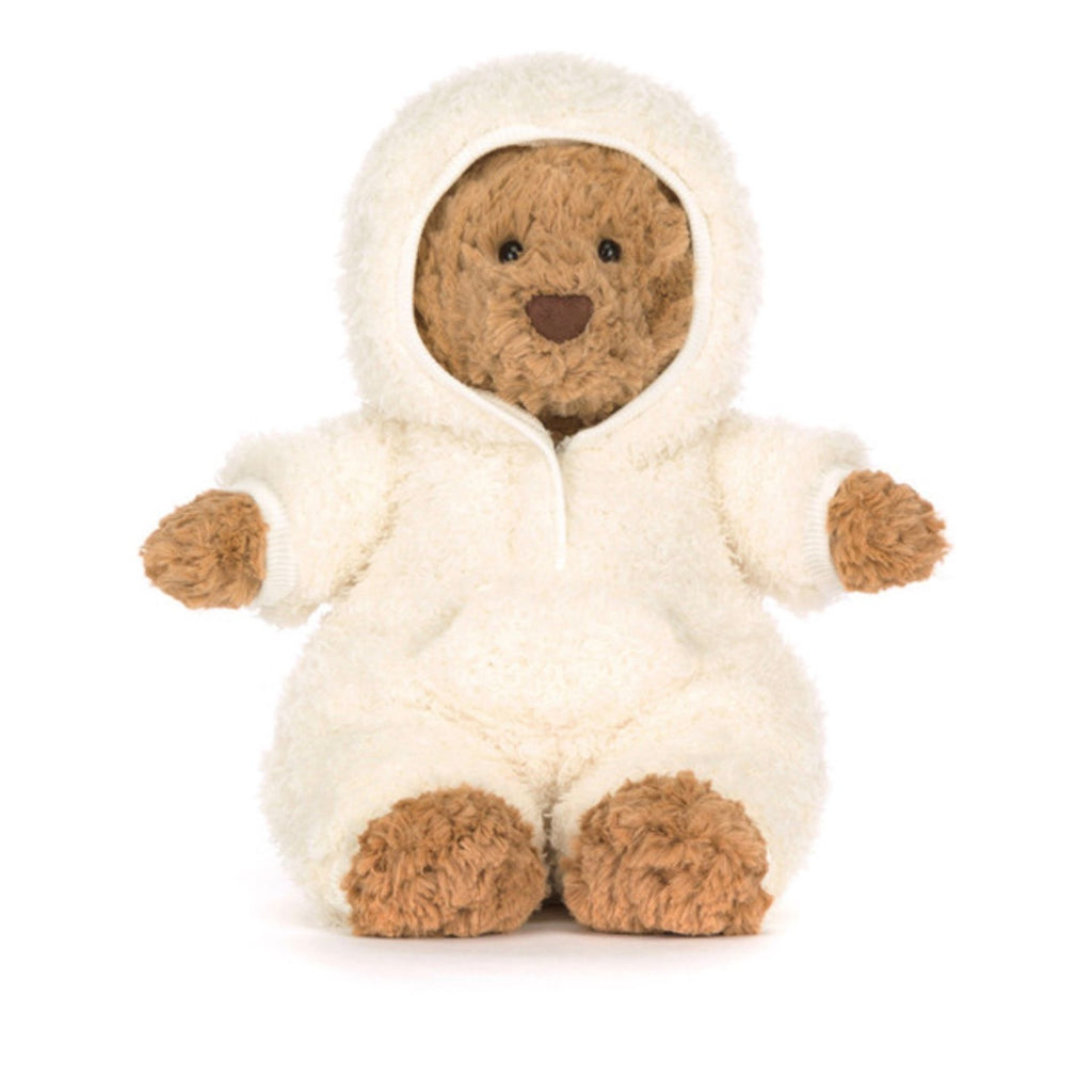 Stuffed bear toy in a white hooded outfit on a white background
