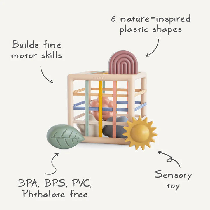 Colorful wooden baby block with geometric shapes on a white background