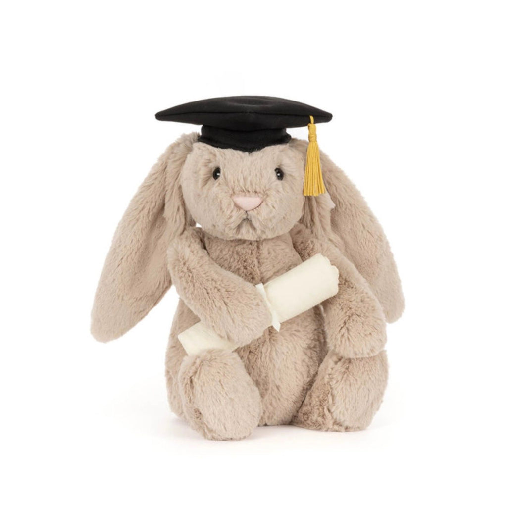 Plush bunny toy wearing a graduation cap and gown on a white background