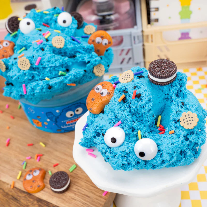 Slime product with blue bow and cookie monster design on a white background