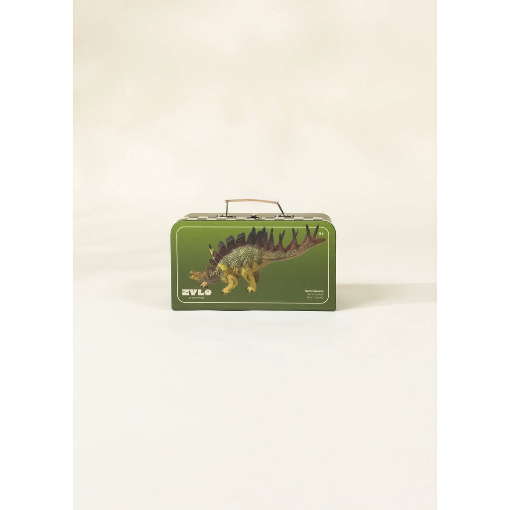 Toy dinosaur with a suitcase and cards on a beige background