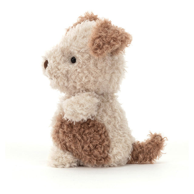 Stuffed animal dog toy with brown and white fur on a white background