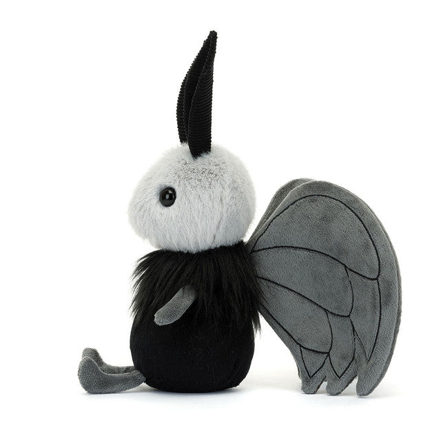 Plush toy with black and gray wings on a white background