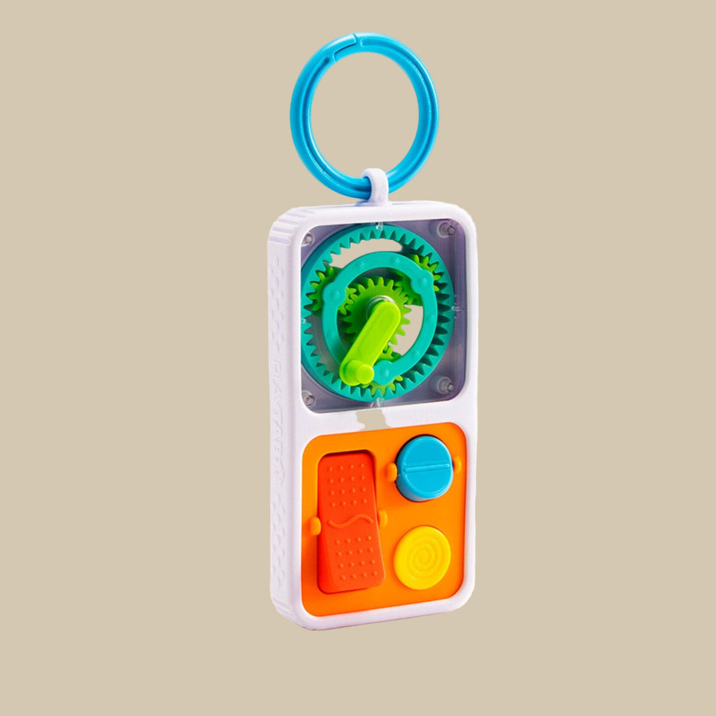 Colorful toy with gears and buttons on a white background