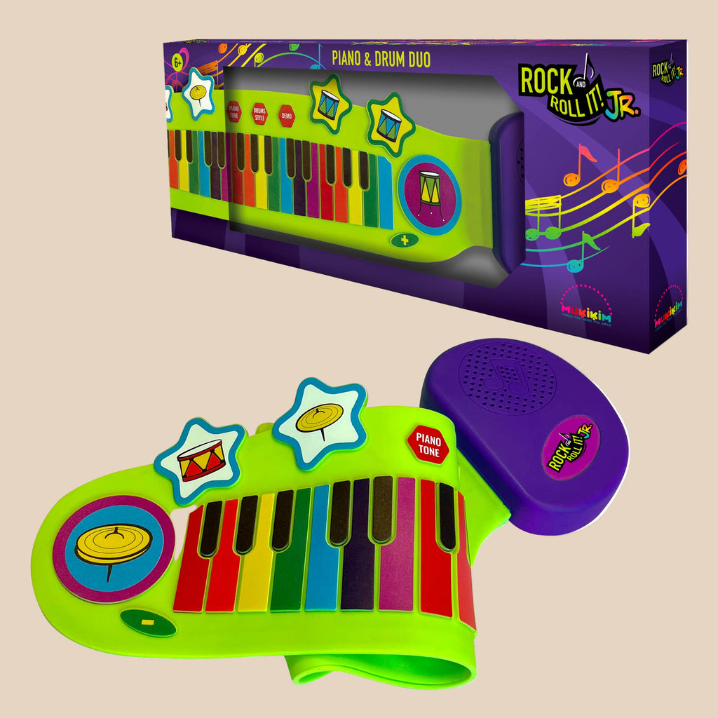 Toy piano and drum set with colorful keys and purple speaker, displayed with packaging.