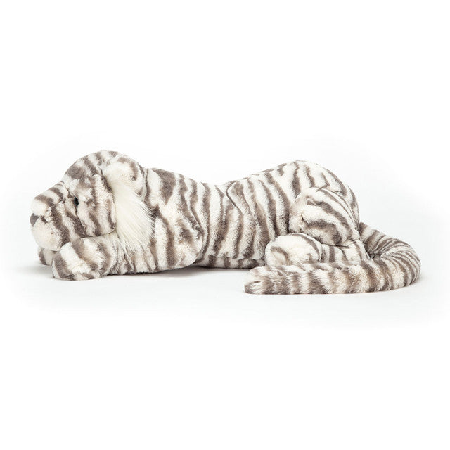 Plush toy snow leopard on a white background