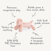 Pink dog-shaped toy on a white background