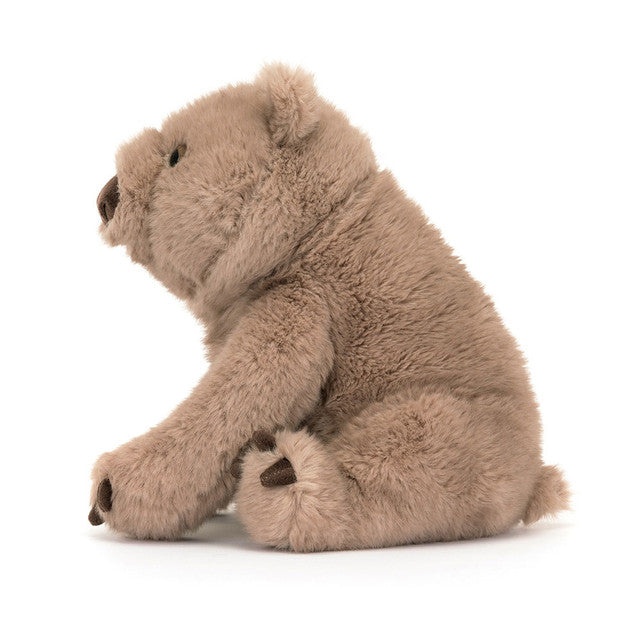 Plush toy bear sitting on a white background