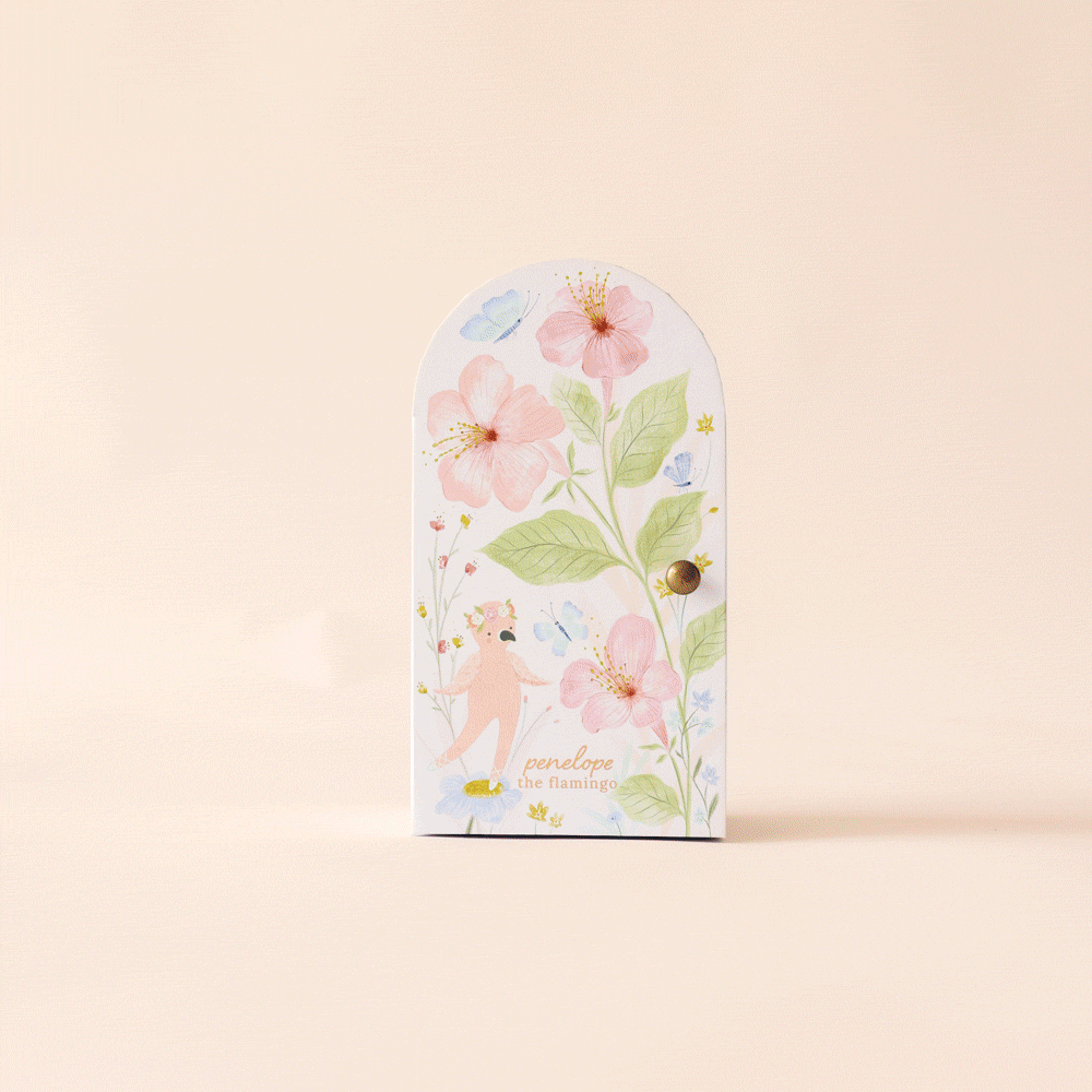 Pink knitted toy with floral design packaging 