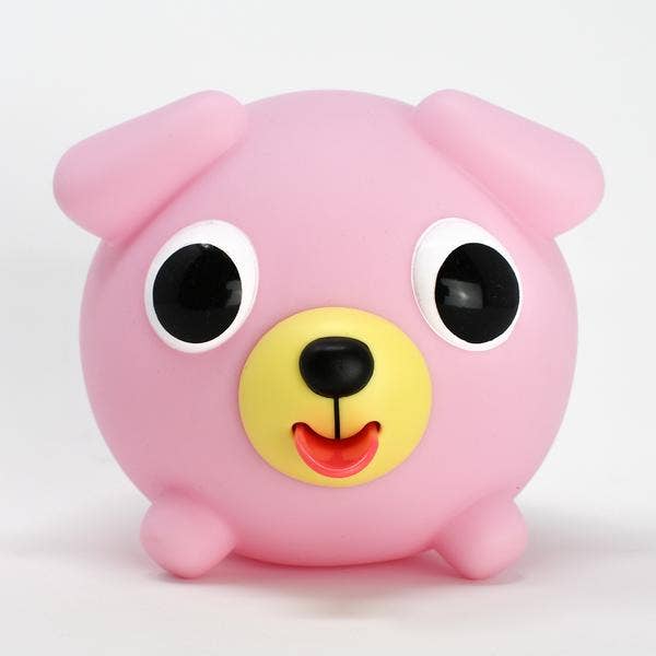 Pink cartoon-like creature with a hand pressing on it against a white background