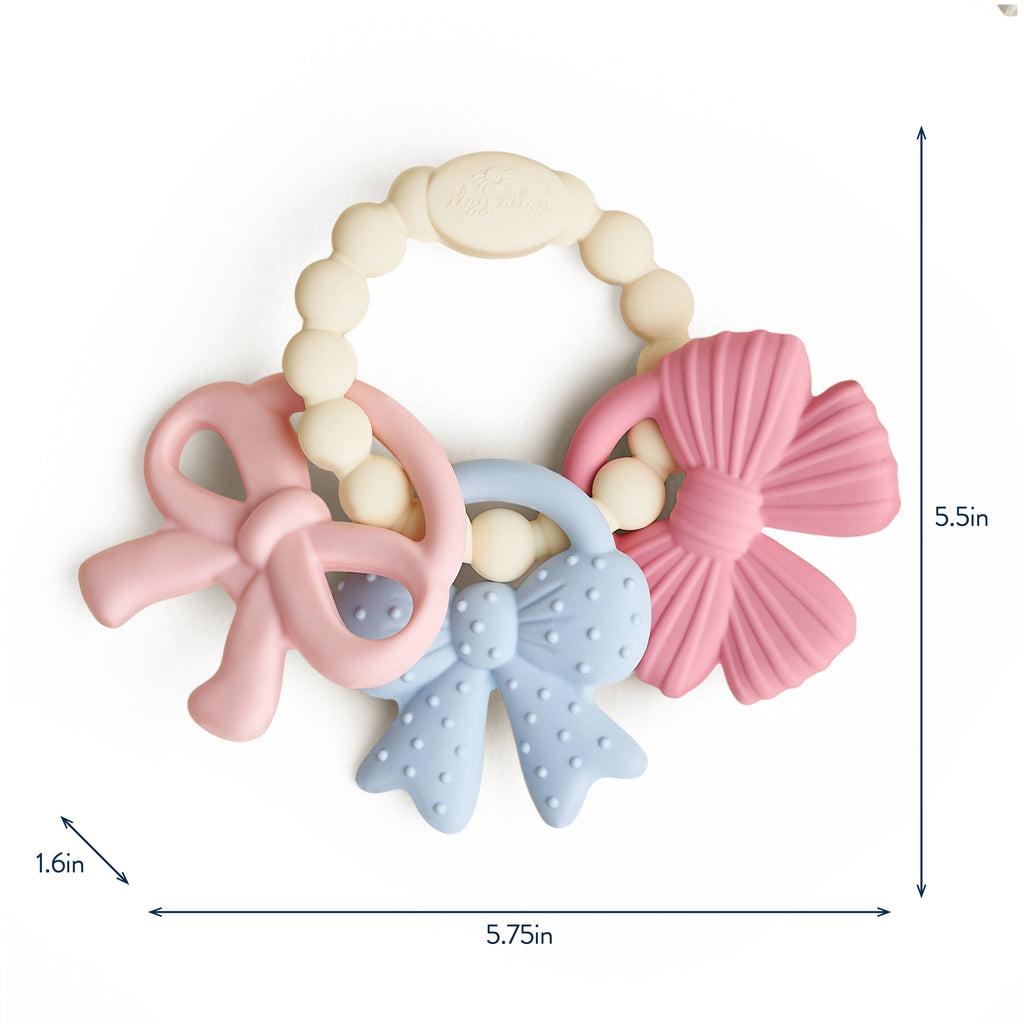 Itzy Ritzy silicone teether set in packaging with brand logo.