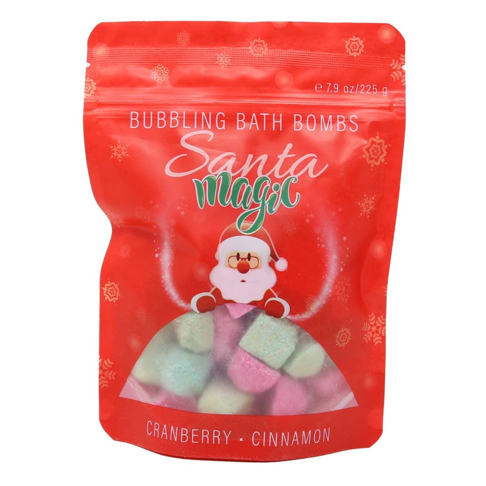 Red bag of Santa Magic bubbling bath bombs with bath bombs on a surface