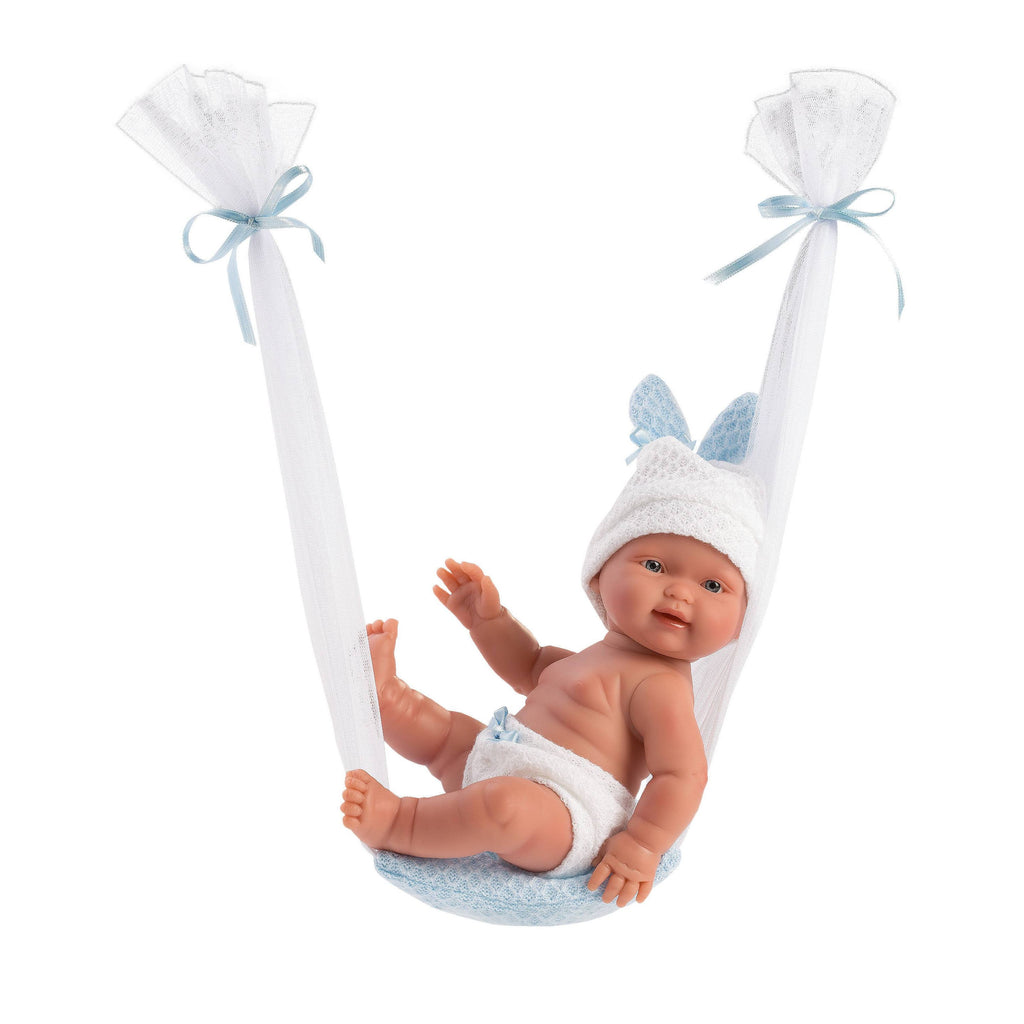 Baby doll in a clear bag with blue ribbons on a gray background