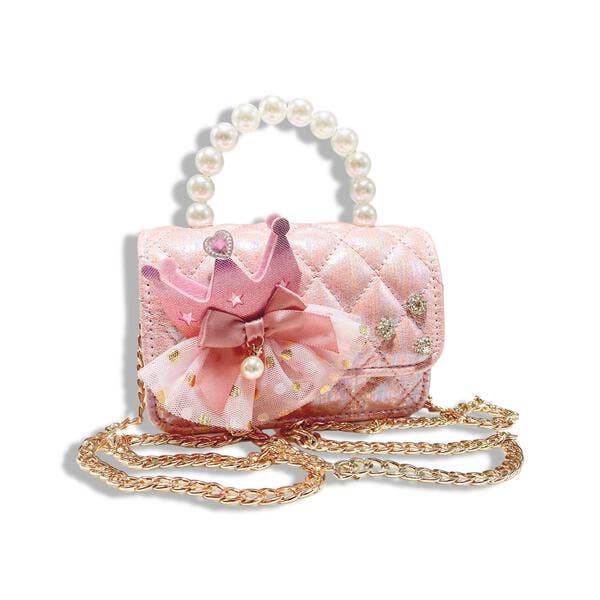 Pink handbag with decorative elements on a white background