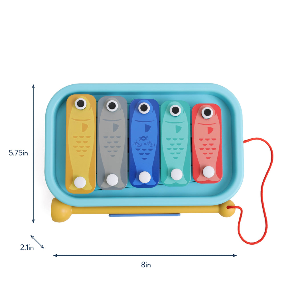 Itzy Music School toy set packaging with colorful xylophone-like instruments.