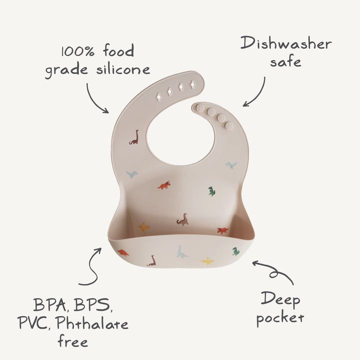 Beige baby silicone bib with dinosaur prints 