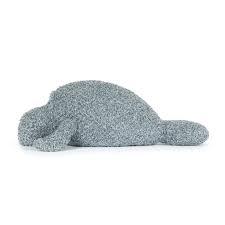 Decorative Manatee made of greenery on a light gray background