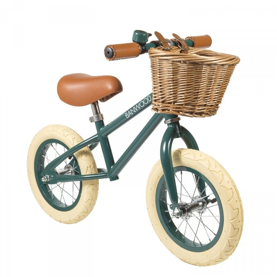 A green balance bike.
